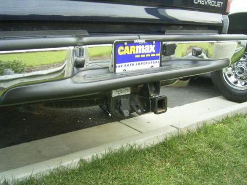 1994 Ford F-150 - Rear view of a Chevrolet truck, showing the bumper, hitch, and a CarMax license plate frame.
