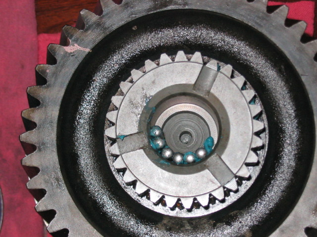Close-up of gears and ball bearings with blue grease
