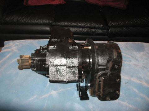 1991 Ford Bronco - A black transfer case is shown, likely a component from a 4x4 vehicle, resting on a blue cloth.