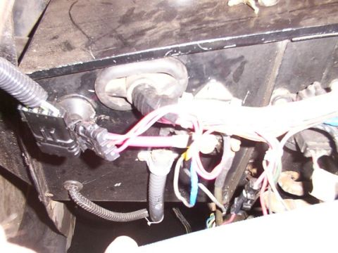 1986 Ford Bronco - Detail of a complex vehicle wiring harness, showing multiple connectors and bundles of wires.