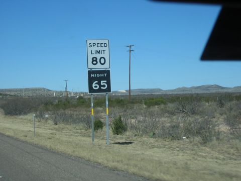1996 Ford Bronco - Rural speed limit signs indicate 80 mph during the day and 65 mph at night.