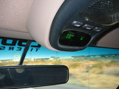1996 Ford Bronco - The digital display in the overhead console shows the temperature and compass direction.