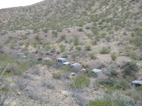 1996 Ford Bronco - A convoy of off-road vehicles navigates a dry, brush-covered hillside.