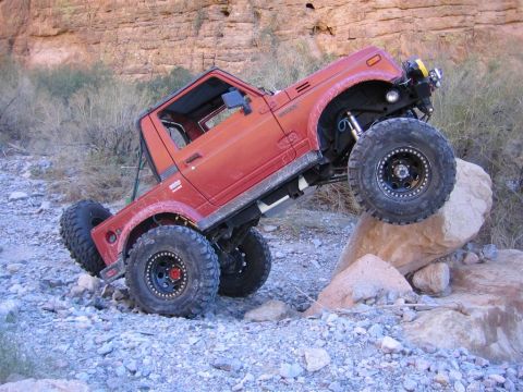 1987 Suzuki Samurai - This modified 1987 Suzuki Samurai is navigating a rocky obstacle course.
