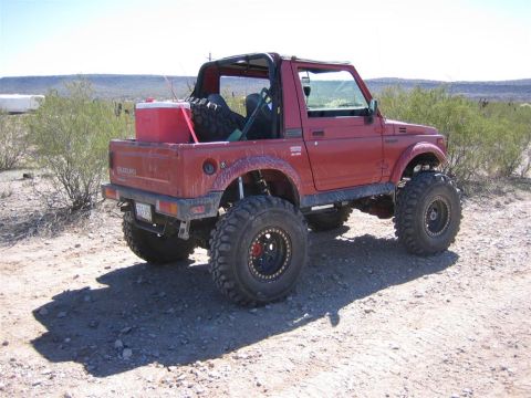 1987 Suzuki Samurai - This modified 1987 Suzuki Samurai is equipped for off-road adventures with its large tires and lifted suspension.