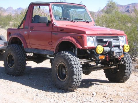 1987 Suzuki Samurai - This modified 1987 Suzuki Samurai is equipped for off-road adventures with its lifted suspension and tires.