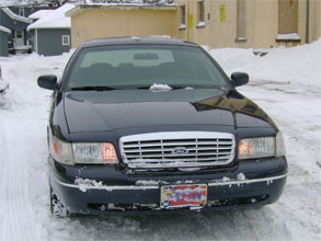 1999 Ford Crown Victoria - Front view of a 1999 Ford Crown Victoria parked in the snow.