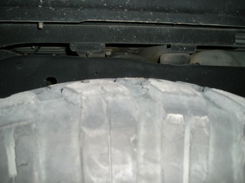 1993 Ford Bronco - Undercarriage view showing a tire and frame components. Supermotors.net logo present.