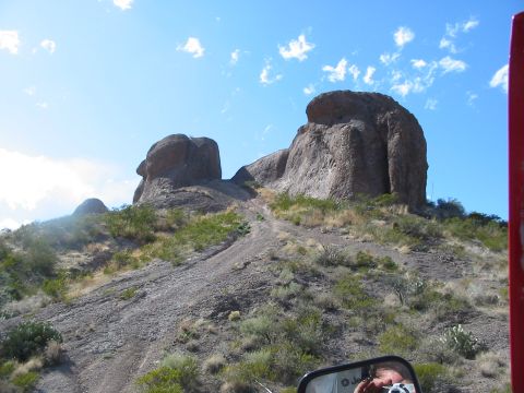 1996 Ford Bronco - Off-roading through a rocky desert terrain with unique geological formations.