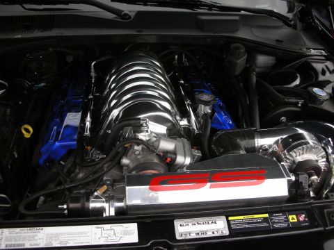 1998 Ford Crown Victoria - engine bay with a chrome intake manifold, conical filter, and a polished cover marked SS in red.