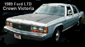 Light blue 1989 Ford LTD Crown Victoria sedan, front 3/4 view, parked outdoors