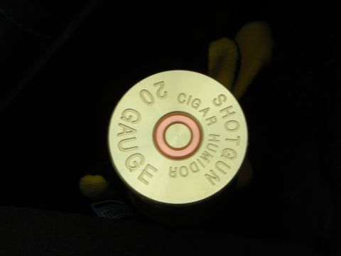 1998 Ford Crown Victoria - brass cylindrical humidor styled like a 20-gauge shotgun shell, lid engraved Shotgun Cigar Humidor 20 Gauge.