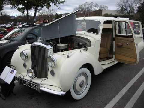 1998 Ford Crown Victoria - cream classic Bentley saloon with hood and rear door open, tan interior, whitewall tires, and UK plate LUK 980.