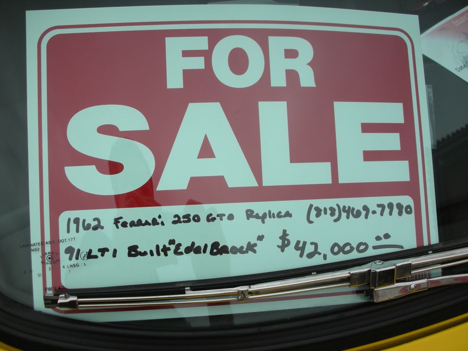 Red and white FOR SALE sign in a windshield with handwritten note for a 1962 Ferrari 250 GTO replica