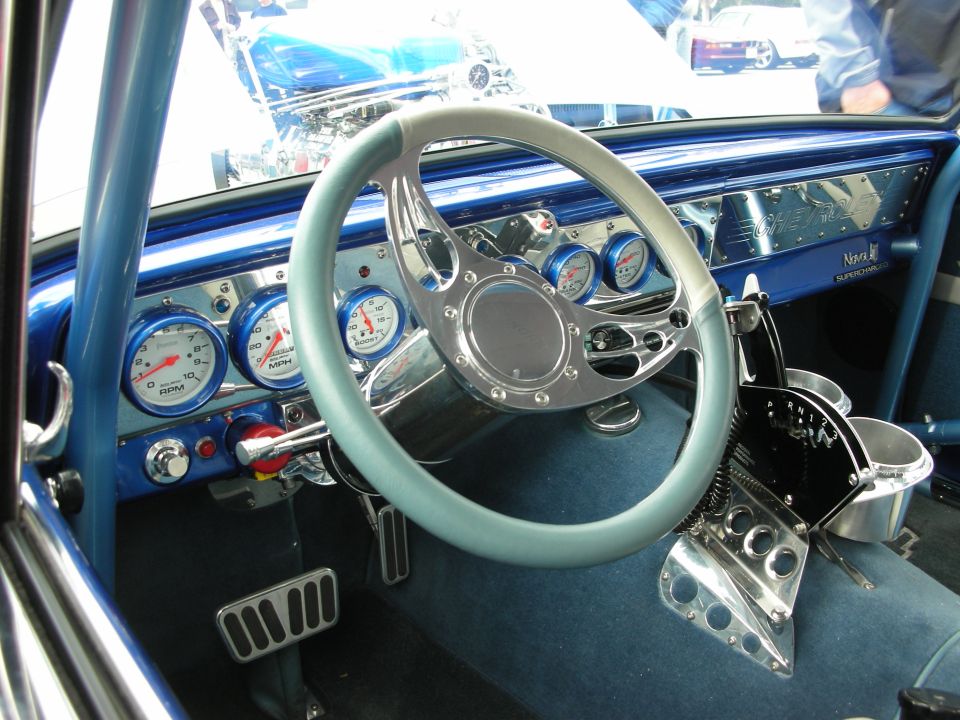 Custom interior with blue dash, white steering wheel and white gauges