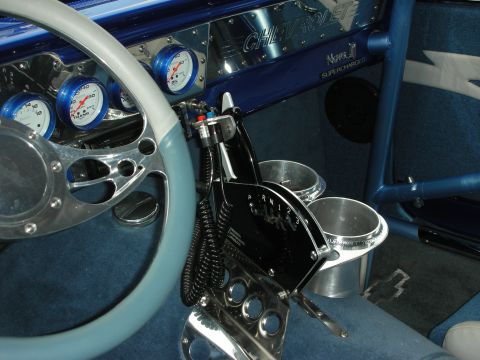 1998 Ford Crown Victoria - custom blue dash engraved Chevrolet Supercharged, with white gauges, a chrome shifter and a billet cup holder.