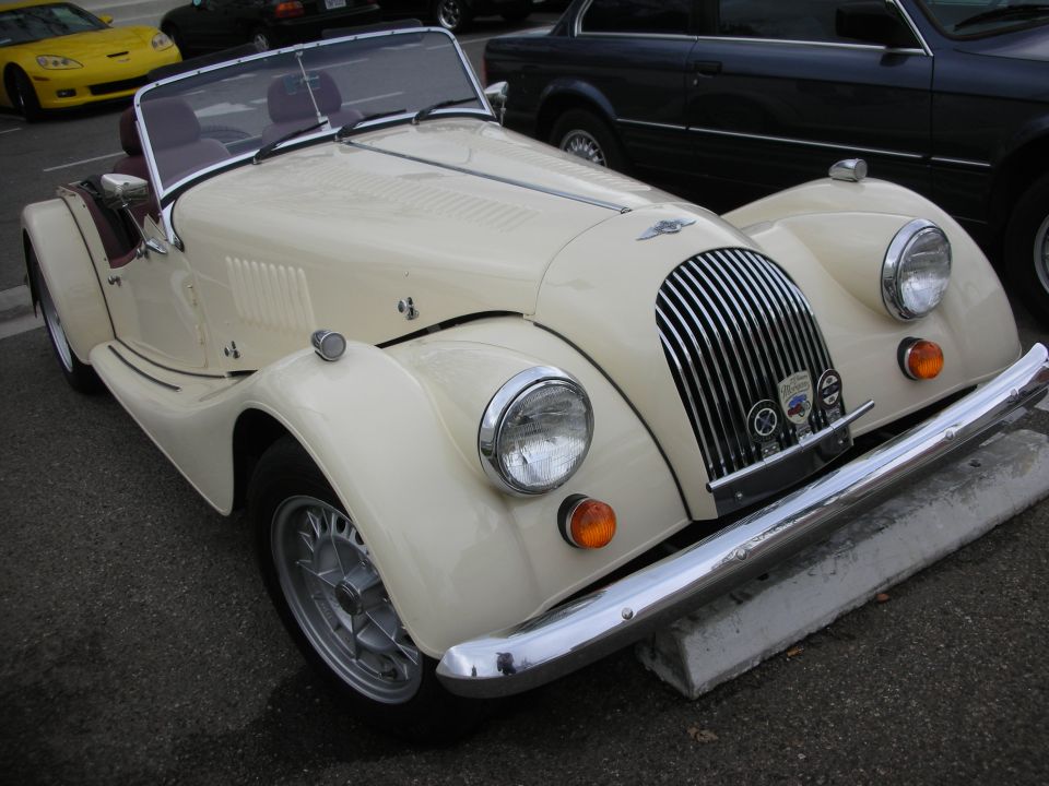 Cream Morgan roadster front three-quarter with chrome grille and wire wheels