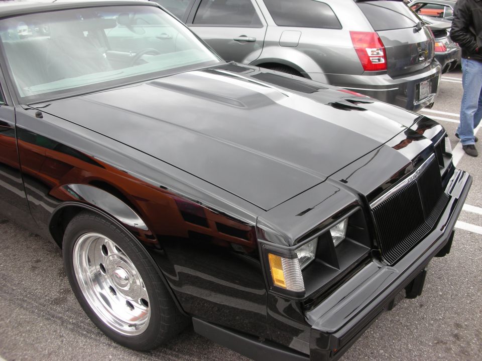 Front of a black Buick Grand National coupe with polished wheels