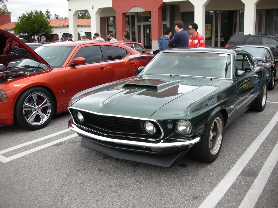 Dark green 1969 Ford Mustang fastback with hood scoop