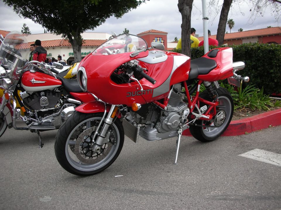Red and silver Ducati half-faired sportbike on its kickstand