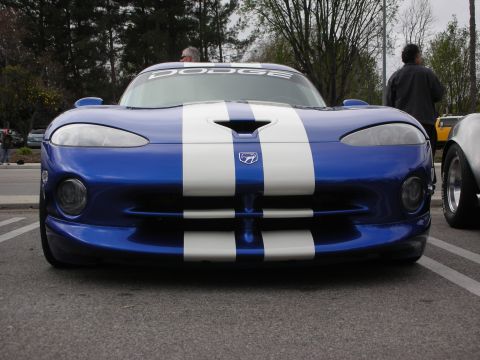 1998 Ford Crown Victoria - Head-on view of a blue Dodge Viper with white racing stripes, badged Dodge across the windshield banner.