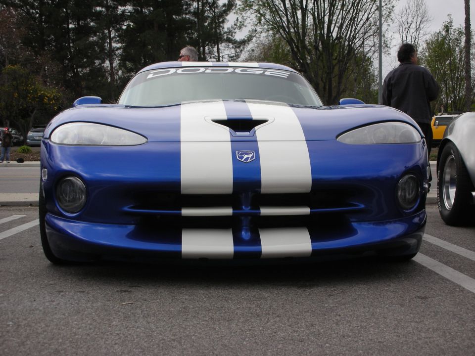 Front of a blue Dodge Viper with white racing stripes