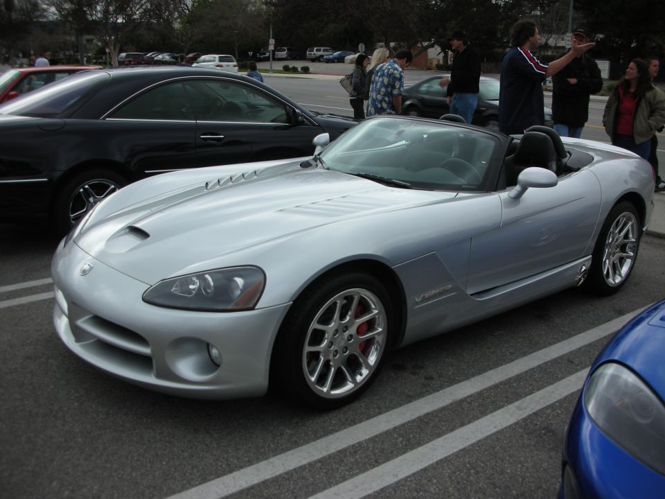 Silver Dodge Viper convertible roadster parked at an outdoor car show