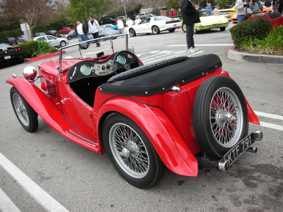 Red MG TC roadster rear quarter with wire wheels and KTF791 plate