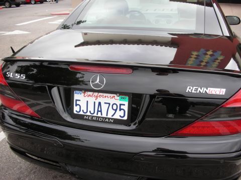 1998 Ford Crown Victoria - Rear of a black Mercedes-Benz SL55 showing SL55 and RENNtech badges and a California plate dated 2007.