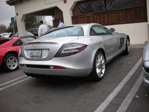1998 Ford Crown Victoria - Rear three-quarter view of a silver Mercedes-Benz SLR McLaren with a California plate reading MBSLR05 at a show.