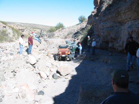 1996 Ford Bronco - Off-roading adventure in a rocky canyon with multiple Jeeps and participants.