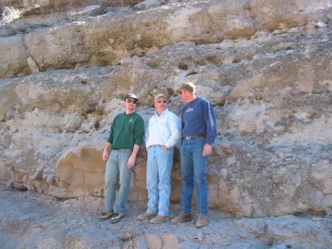 1996 Ford Bronco - Three men pose in front of a geological formation, possibly during a field trip or expedition.