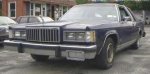 1984 Mercury Grand Marquis - Front 3/4 view of a 1984 Mercury Grand Marquis sedan parked outdoors.
