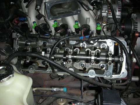 1992 Ford Crown Victoria - The engine's valve train and fuel injectors are exposed for maintenance or repair.