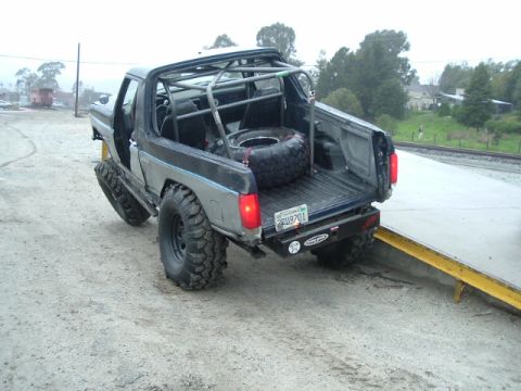 1989 Ford Bronco - This modified 1989 Ford Bronco is equipped with a full roll cage and large off-road tires, ready for terrain.