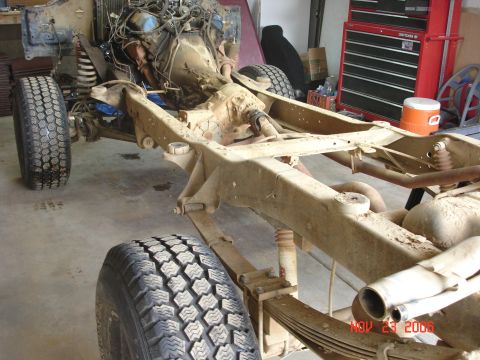 1978 Ford Bronco - The frame and engine of a 1978 Ford Bronco are visible during a tear down process.