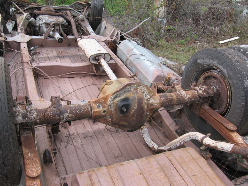 Rusty truck frame, rear axle, and fuel tank