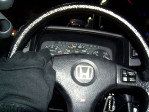 1993 Ford Probe - View from the driver's seat, focusing on the steering wheel and instrument cluster.