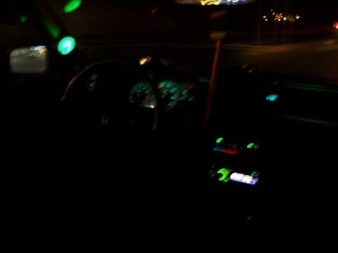 1993 Ford Probe - Interior view of a car at night with illuminated dashboard and green lights.