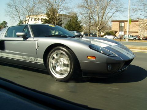 1993 Ford Probe - This Ford GT is captured in motion, its iconic design and racing stripes.