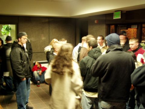 1993 Ford Probe - A gathering of people inside a building, with some individuals standing and others seated.