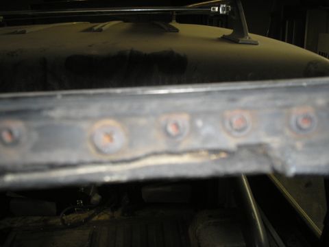 1966 Ford Bronco - Detail of the roof rack attachment points, showing signs of wear and rust.
