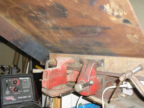 1966 Ford Bronco - A Lincoln Electric Pro-Mig 135 welder and two red vises are visible on a workbench.