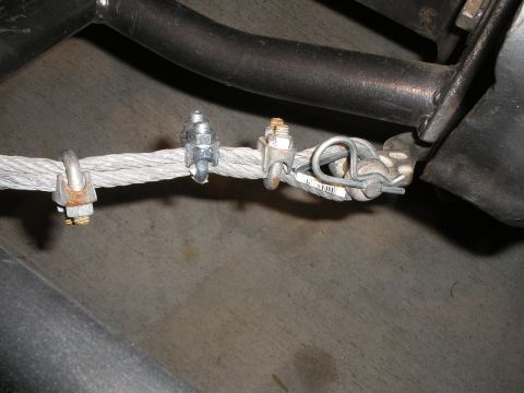 1990 Ford Bronco - Close-up of a cable assembly with multiple clamps and a small tag attached.