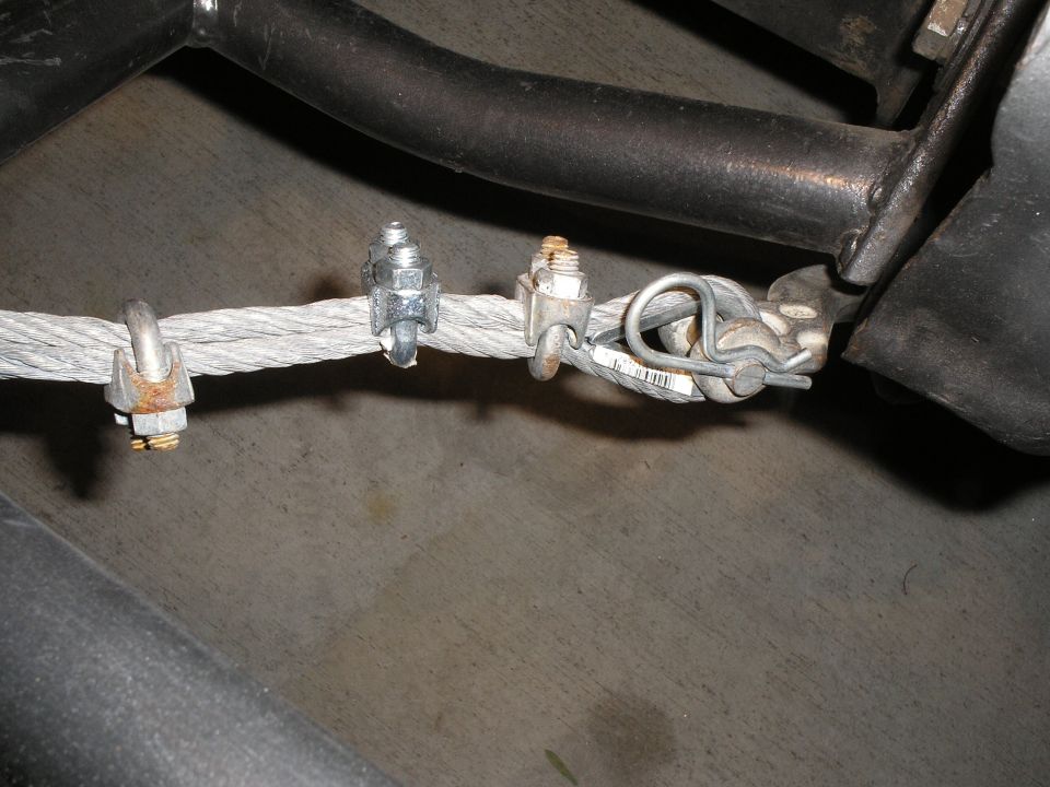 Cable with three U-bolt clamps and a metal tag