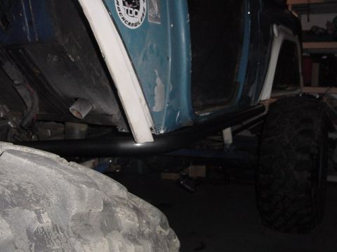 1971 Ford Bronco - This modified vehicle features large off-road tires and protective rock sliders along its side.