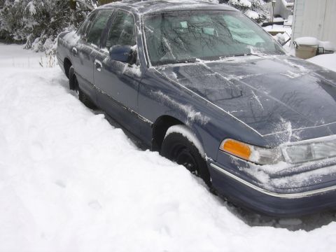 1996 Ford Crown Victoria - Blue 1996 Ford Crown Victoria stuck in deep snow during winter weather.
