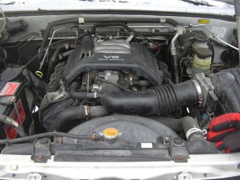 1996 Ford Crown Victoria - Engine bay view showing the V6 DOHC 24 valve engine cover and surrounding components.