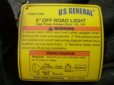 1988 Ford Bronco - This yellow tag details a 5" Off Road Light, including safety warnings and a wiring diagram for installation.