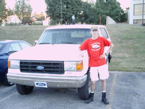 1988 Ford Bronco - A man poses next to a white Ford Bronco in a parking lot.